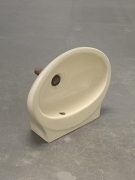 Plug, 2018. Ceramic sink, hand-rolled cigar,