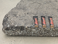 Mars (detail), 2018. Two asphalt blocks and 6 Mars bars,