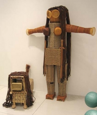 The Princess Warrior and Her Dog!, 2005. Baskets, wood beads, duster, wood shades, slippers, wood stands, warrior: 90 x 71 x 20 inches (228.6 x 180.3 x 50.8 cm); dog: 30 x 18 x 47 inches (76.2 x 45.7 x 119.4 cm). MP 8