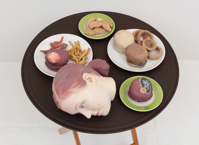 Josh Kline, 15% Service (Applebee&#039;s Waitress&#039; Head), 2018. 3D-printed sculptures in plaster with inkjet ink and cyanoacrylate, custom tray, wooden stand, 38 1/4 x 28 1/2 x 28 1/2 inches (97.2 x 72.4 x 72.4 cm).
