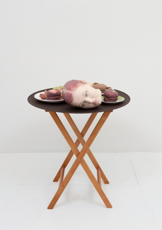Josh Kline, 15% Service (Applebee&#039;s Waitress&#039; Head), 2018. 3D-printed sculptures in plaster with inkjet ink and cyanoacrylate, custom tray, wooden stand, 38 1/4 x 28 1/2 x 28 1/2 inches (97.2 x 72.4 x 72.4 cm).